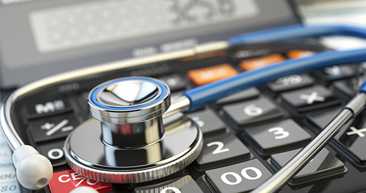 Health care costs concept. Stethoscope and calculator of medica