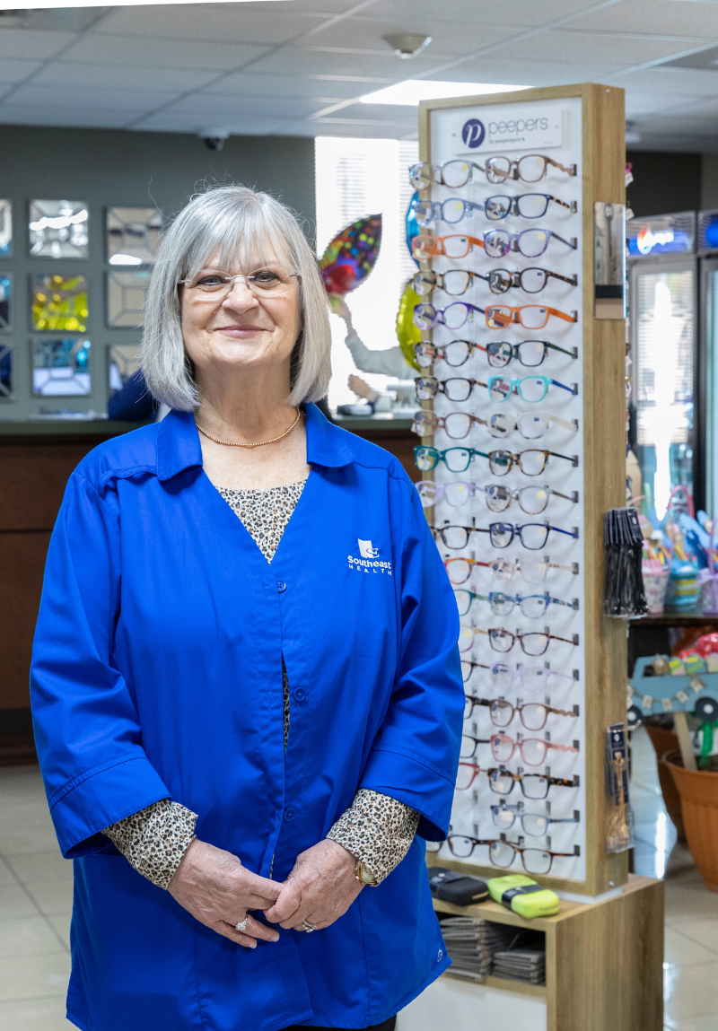 Adult Volunteer in gift shop.