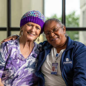 patient navigators Adult Volunteer in gift shop.