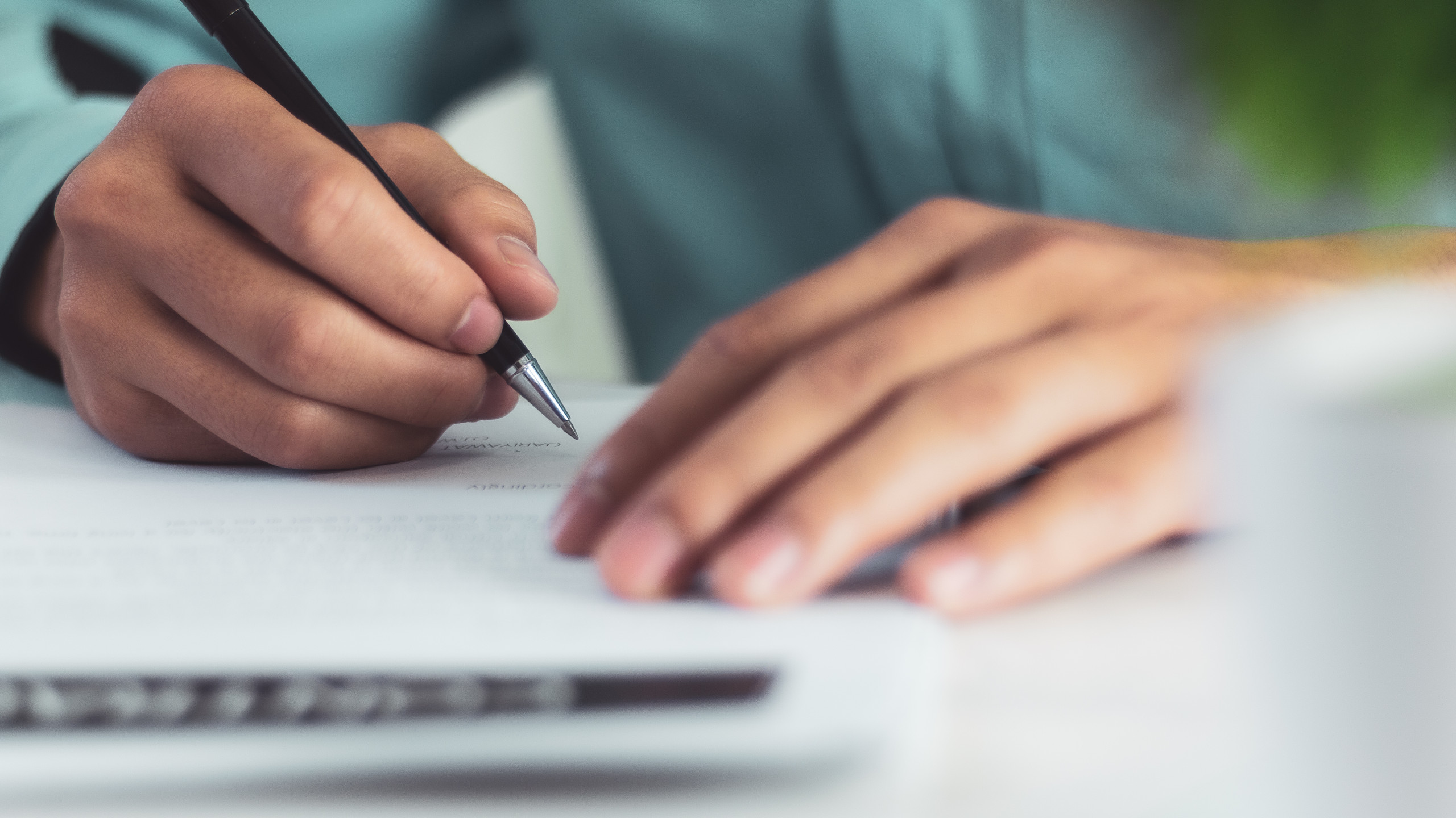 Businessman,Signing,A,Document,After,Reading,The,Agreement,In,Office Southeast Health Medical Center