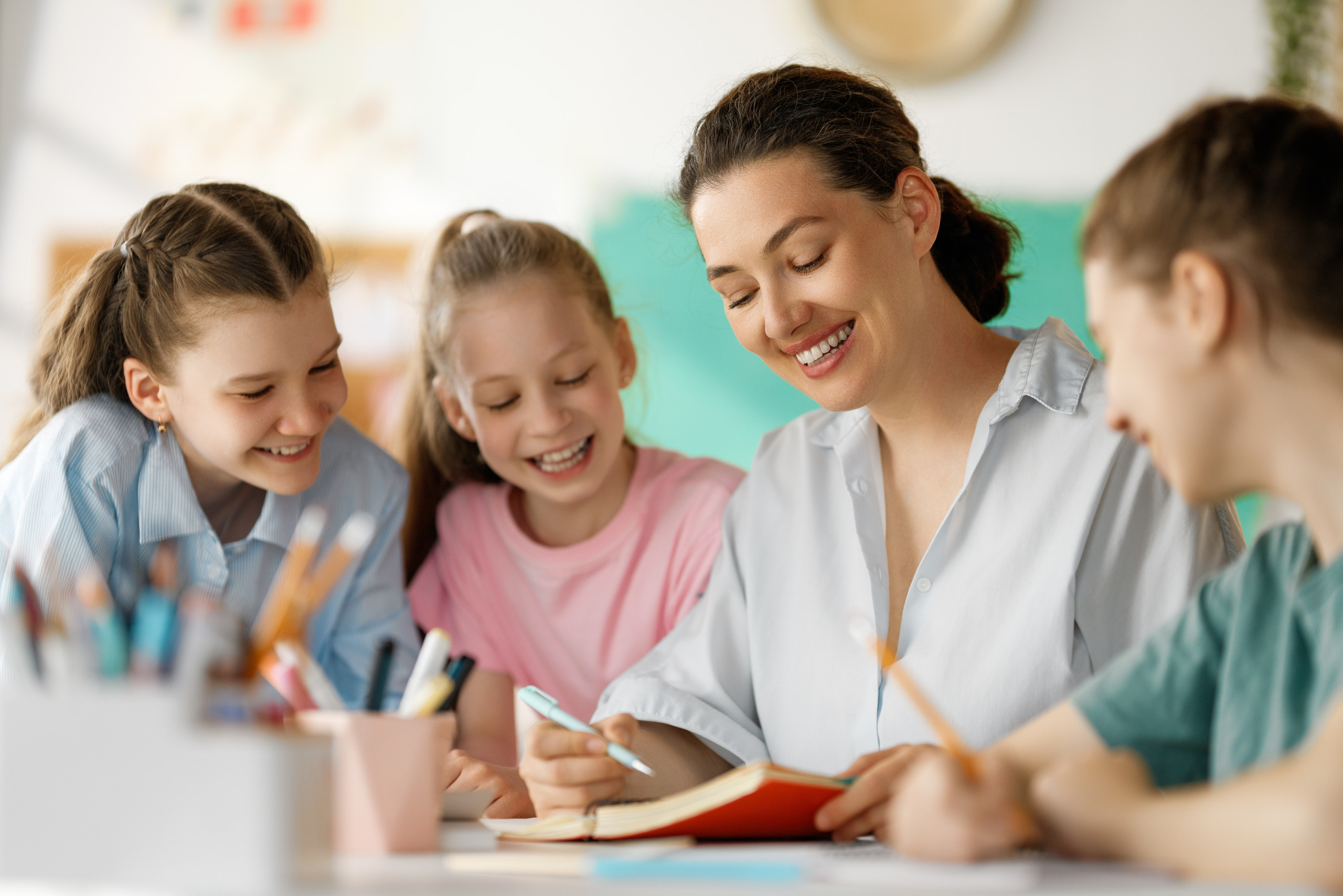 Happy,Kids,And,Teacher,At,School.,Woman,And,Children,Are